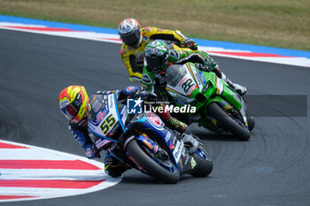 2024-06-15 - (55) Andrea Locatelli from Italy of Pata Prometeon Yamaha Team, rides Yamaha YZF R1 followed by (22) Alex Lowes from United Kingdom of Kawasaki Racing Team World SBK, rides Kawasaki ZX-10RRin action during the FIM Motul Superbike World Championship - Race 1 of Emilia Romagna Round at Marco Simoncelli World Circuit in Misano Adriatico on June 15, 2024 in Misano Adriatico, Rimini, Italy. - PIRELLI EMILIA ROMAGNA ROUND - RACE 1 - SUPERBIKE - MOTORS