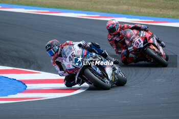 2024-06-15 - (45) Scott Redding from United Kingdom of Bonovo Action BMW Team, rides BMW M1000 RR and (51) Michele Pirro from Italy of Aruba.it - Ducati Team, rides Ducati Panigale V4Rin action during the FIM Motul Superbike World Championship - Race 1 of Emilia Romagna Round at Marco Simoncelli World Circuit in Misano Adriatico on June 15, 2024 in Misano Adriatico, Rimini, Italy. - PIRELLI EMILIA ROMAGNA ROUND - RACE 1 - SUPERBIKE - MOTORS