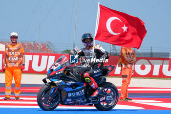 2024-06-15 - (54) Toprak Razgatlioglu from Turkey of ROKiT BMW Motored WorldSBK Team, rides BMW M1000 RR celebrates the victory of the FIM Motul Superbike World Championship - Race 1 of Emilia Romagna Round at Marco Simoncelli World Circuit in Misano Adriatico on June 15, 2024 in Misano Adriatico, Rimini, Italy. - PIRELLI EMILIA ROMAGNA ROUND - RACE 1 - SUPERBIKE - MOTORS