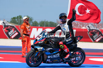 2024-06-15 - (54) Toprak Razgatlioglu from Turkey of ROKiT BMW Motored WorldSBK Team, rides BMW M1000 RR celebrates the victory of the FIM Motul Superbike World Championship - Race 1 of Emilia Romagna Round at Marco Simoncelli World Circuit in Misano Adriatico on June 15, 2024 in Misano Adriatico, Rimini, Italy. - PIRELLI EMILIA ROMAGNA ROUND - RACE 1 - SUPERBIKE - MOTORS