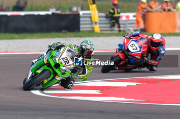 2024-09-21 - (22) Alex Lowes from United Kingdom of Kawasaki Racing Team World SBK, rides Kawasaki ZX-10RR followed by (97) Xavi Vierge from Spain of Team HRC, rides Honda CBR1000 RR during the FIM Motul Superbike World Championship - Tissot Superpole Race of Acerbis Italian Round at Cremona Circuit in San Martino del Lago on September 21, 2024, Cremona, Italy. - ACERBIS ITALIAN ROUND - SUPERPOLE - SUPERBIKE - MOTORS