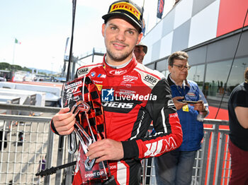 2024-05-18 - #32 Dries Vanthoor Of The Team Wrt, Bmw M4 Gt3, On The Podium After Race 1, During Fanatec GT World Challange Misano 2024 , 18 May , In Misano , Italy - FANATEC GT WORLD CHALLANGE MISANO 2024 - GRAND TOURISM - MOTORS