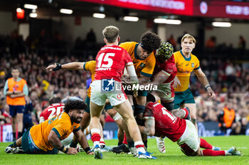 2024-11-17 - Rob Valetini of Australia under pressure from Christ Tshiunza of Wales during the 2024 Autumn Nations Series rugby union match between Wales and Australia on 17 November 2024 at Millenium Stadium in Cardiff, Wales - RUGBY - AUTUMN NATIONS SERIES 2024 - WALES V AUSTRALIA - AUTUMN NATIONS SERIES - RUGBY