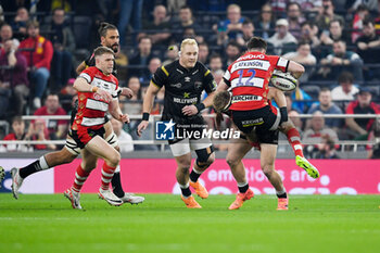 24/05/2024 - Gloucester Rugby Centre Seb Atkinson (12) is tackled by Hollywoodbets Sharks Back row James Venter (6) during the European Rugby Challenge Cup, Final rugby union match between Gloucester Rugby and Hollywoodbets Sharks on 24 May 2024 at Tottenham Hotspur Stadium in London, England - RUGBY - CHALLENGE CUP - FINAL - GLOUCESTER V SHARKS - CHALLENGE CUP - RUGBY