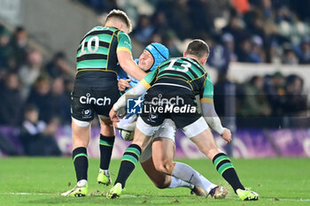 2024-01-12 - Northampton Saints fly half Fin Smith (10) and Northampton Saints centre Fraser Dingwall (13) tackle Bayonne full back Yan Lestrade (23) during the Champions Cup, rugby union match between Northampton Saints and Aviron Bayonnais (Bayonne) on 12 January 2024 at Franklins Gardens in Northampton, England - RUGBY - CHAMPIONS CUP - NORTHAMPTON V BAYONNE - CHAMPIONS CUP - RUGBY