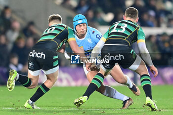2024-01-12 - Northampton Saints fly half Fin Smith (10) and Northampton Saints centre Fraser Dingwall (13) tackle Bayonne full back Yan Lestrade (23) during the Champions Cup, rugby union match between Northampton Saints and Aviron Bayonnais (Bayonne) on 12 January 2024 at Franklins Gardens in Northampton, England - RUGBY - CHAMPIONS CUP - NORTHAMPTON V BAYONNE - CHAMPIONS CUP - RUGBY