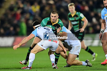 2024-01-12 - Northampton Saints wing Ollie Sleightholme (11) tackled by Bayonne scrum-half Maxime Machenaud (9) during the Champions Cup, rugby union match between Northampton Saints and Aviron Bayonnais (Bayonne) on 12 January 2024 at Franklins Gardens in Northampton, England - RUGBY - CHAMPIONS CUP - NORTHAMPTON V BAYONNE - CHAMPIONS CUP - RUGBY