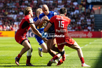 2024-04-14 - Olly Woodburn of Exeter Chiefs is tackled by Paul Costes, Blair Kinghorn of Toulouse during the European Rugby Champions Cup, quarter final, rugby union match between Stade Toulousain (Toulouse) and Exeter Chiefs on 14 April 2024 at Stade Ernest-Wallon in Toulouse, France - RUGBY - CHAMPIONS CUP - TOULOUSE V EXETER - CHAMPIONS CUP - RUGBY