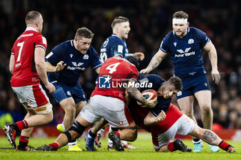 2024-02-03 - Alec Hepburn of Scotland tackled by Dafydd Jenkins of Wales during the 2024 Six nations Championship, rugby union match between Wales and Scotland on 3 February 2024 at Millenium Stadium in Cardiff, Wales - RUGBY - SIX NATIONS 2024 - WALES V SCOTLAND - SIX NATIONS - RUGBY