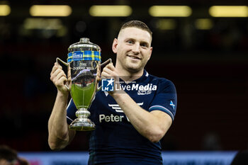 2024-02-03 - Finn Russell of Scotland holds the Doddie Weir Cup after the 2024 Six nations Championship, rugby union match between Wales and Scotland on 3 February 2024 at Millenium Stadium in Cardiff, Wales - RUGBY - SIX NATIONS 2024 - WALES V SCOTLAND - SIX NATIONS - RUGBY