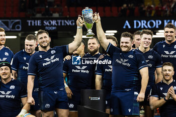 2024-02-03 - Scotland hold aloft the Doddie Weir Cup after the 2024 Six nations Championship, rugby union match between Wales and Scotland on 3 February 2024 at Millenium Stadium in Cardiff, Wales - RUGBY - SIX NATIONS 2024 - WALES V SCOTLAND - SIX NATIONS - RUGBY