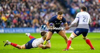 2024-02-10 - Huw Jones of Scotland tries to break through the tackle of Alexandre Roumat of France during the 2024 Six nations Championship, rugby union match between Scotland and France on 10 February 2024 at Scottish Gas Murrayfield in Edinburgh, Scotland - RUGBY - SIX NATIONS 2024 - SCOTLAND V FRANCE - SIX NATIONS - RUGBY
