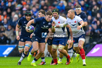 2024-02-10 - Huw Jones of Scotland runs at Gael Fickou of France during the 2024 Six nations Championship, rugby union match between Scotland and France on 10 February 2024 at Scottish Gas Murrayfield in Edinburgh, Scotland - RUGBY - SIX NATIONS 2024 - SCOTLAND V FRANCE - SIX NATIONS - RUGBY