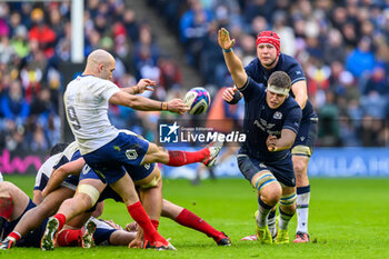 2024-02-10 - Scott Cummings of Scotland tries to block a kick from Maxime Lucu of France during the 2024 Six nations Championship, rugby union match between Scotland and France on 10 February 2024 at Scottish Gas Murrayfield in Edinburgh, Scotland - RUGBY - SIX NATIONS 2024 - SCOTLAND V FRANCE - SIX NATIONS - RUGBY