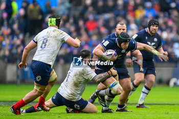 2024-02-10 - Jack Dempsey of Scotland is tackled by Cyril Baille of France during the 2024 Six nations Championship, rugby union match between Scotland and France on 10 February 2024 at Scottish Gas Murrayfield in Edinburgh, Scotland - RUGBY - SIX NATIONS 2024 - SCOTLAND V FRANCE - SIX NATIONS - RUGBY