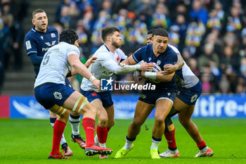 2024-02-10 - Sione Tuipulotu of Scotland is tackled by Matthieu Jalibert and Jonathan Danty of France during the 2024 Six nations Championship, rugby union match between Scotland and France on 10 February 2024 at Scottish Gas Murrayfield in Edinburgh, Scotland - RUGBY - SIX NATIONS 2024 - SCOTLAND V FRANCE - SIX NATIONS - RUGBY