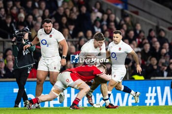 2024-02-10 - Tommy Freeman of England is tackled by Tommy Reffell of Wales during the 2024 Six nations Championship, rugby union match between England and Wales on 10 February 2024 at Twickenham stadium in London, England - RUGBY - SIX NATIONS 2024 - ENGLAND V WALES - SIX NATIONS - RUGBY