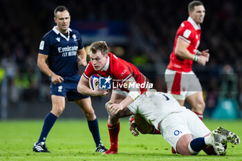 2024-02-10 - Nick Tompkins of Wales is tackled by Joe Marler of England during the 2024 Six nations Championship, rugby union match between England and Wales on 10 February 2024 at Twickenham stadium in London, England - RUGBY - SIX NATIONS 2024 - ENGLAND V WALES - SIX NATIONS - RUGBY