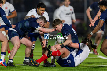 2024-02-09 - Leo Chauvin of France strips the ball from Isaac Coates of Scotland during the 2024 Under 20 Six Nations championship, rugby union match between Scotland and France on 9 February 2024 at the Hive Stadium in Edinburgh, Scotland - RUGBY - U20 SIX NATIONS 2024 - SCOTLAND V FRANCE - SIX NATIONS - RUGBY