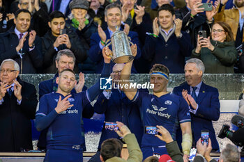 2024-02-24 - Finn Russell and Rory Darge of Scotland lift the Calcutta Cup after winning the 2024 Six nations Championship, rugby union match between Scotland and England on 24 February 2024 at Scottish Gas Murrayfield in Edinburgh, Scotland - RUGBY - SIX NATIONS 2024 - SCOTLAND V ENGLAND - SIX NATIONS - RUGBY