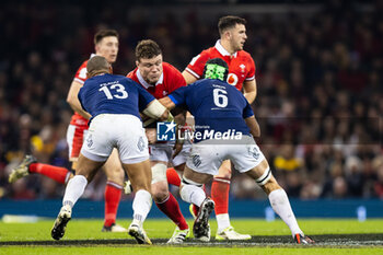 10/03/2024 - Will Rowlands of Wales is tackled by Gael Fickou, François Cros of France during the 2024 Six nations Championship, rugby union match between Wales and France on 10 March 2024 at Millenium Stadium in Cardiff, Wales - RUGBY - SIX NATIONS 2024 - WALES V FRANCE - 6 NAZIONI - RUGBY