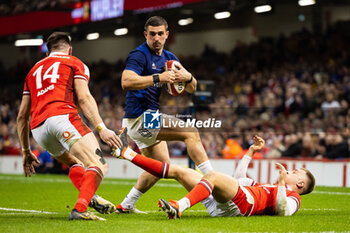 10/03/2024 - Thomas Ramos of France under pressure from Josh Adams of Wales during the 2024 Six nations Championship, rugby union match between Wales and France on 10 March 2024 at Millenium Stadium in Cardiff, Wales - RUGBY - SIX NATIONS 2024 - WALES V FRANCE - 6 NAZIONI - RUGBY