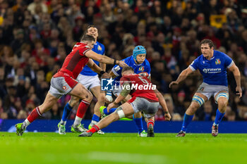 2024-03-16 - Ross Vintcent of Italy is tackled by Alex Mann of Wales during the 2024 Six nations Championship, rugby union match between Wales and Italy on 16 March 2024 at Millenium Stadium in Cardiff, Wales - RUGBY - SIX NATIONS 2024 - WALES V ITALY - SIX NATIONS - RUGBY