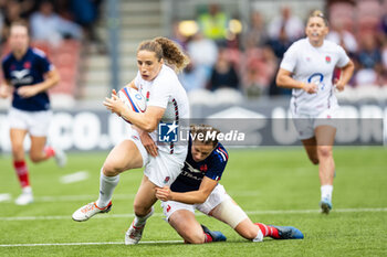 2024-09-07 - Jess Breach of England is tackled by Emilie Boulard of France during the Rugby International match between England Women and France Women at the Kingsholm Stadium, Gloucester, United Kingdom on 7 September 2024. Photo Simon King /ProSportsImages / DPPI - RUGBY - TEST MATCH - ENGLAND V FRANCE WOMEN - TEST MATCH - RUGBY