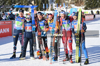 2024-01-20 - Team Germany in first position together a Team Norway and Team Austria celebrating - IBU BIATHLON WORLD CUP 2024 - SINGLE MIXED RELAY (W+M) - BIATHLON - WINTER SPORTS