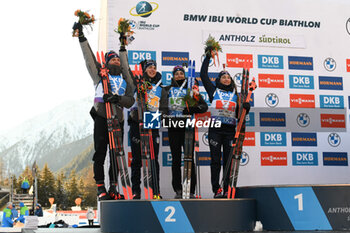 2024-01-20 - Italy team with Dorothea Wierer, Lisa Vitozzi, Didier Bionaz and Tommaso Giacomel celebrating on the padium the second place - IBU BIATHLON WORLD CUP 2024 - MIXED RELAY (W+M) - BIATHLON - WINTER SPORTS