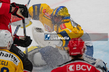 2024-01-23 - Lausanne Switzerland, 01/23/2024: Sandro Aeschilman (goalie) of HC Davos #29 makes a stop during Lausanne HC Versus HC Davos. The match of the 40th day of the 2023-2024 season took place at the Vaudoise Arena in Lausanne between Lausanne HC and HC Davos. - SWISS NATIONAL LEAGUE - LAUSANNE HC VS HC DAVOS - ICE HOCKEY - WINTER SPORTS