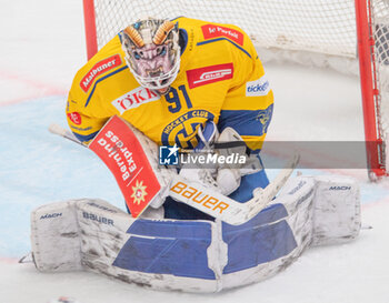 2024-01-23 - Lausanne Switzerland, 01/23/2024: Gilles Sean (goalie) of HC Davos #91 makes a stop during Lausanne HC Versus HC Davos. The match of the 40th day of the 2023-2024 season took place at the Vaudoise Arena in Lausanne between Lausanne HC and HC Davos. - SWISS NATIONAL LEAGUE - LAUSANNE HC VS HC DAVOS - ICE HOCKEY - WINTER SPORTS