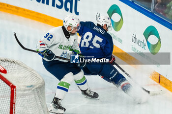 2024-04-24 - Lucien ONNO of France and Anze KURALT of Slovenia during the International Friendly Ice Hockey match between France and Slovenia on April 24, 2024 at Aren’Ice in Cergy-Pontoise, France - ICE HOCKEY - FRIENDLY GAME - FRANCE V SLOVENIA - ICE HOCKEY - WINTER SPORTS
