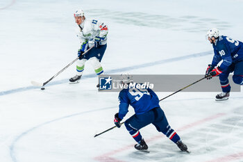 2024-04-24 - Jan DROZG of Slovenia and Kevin BOZON of France during the International Friendly Ice Hockey match between France and Slovenia on April 24, 2024 at Aren’Ice in Cergy-Pontoise, France - ICE HOCKEY - FRIENDLY GAME - FRANCE V SLOVENIA - ICE HOCKEY - WINTER SPORTS