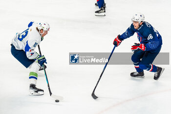 2024-04-24 - Yohan COULAUD of France and Jan DROZG of Slovenia during the International Friendly Ice Hockey match between France and Slovenia on April 24, 2024 at Aren’Ice in Cergy-Pontoise, France - ICE HOCKEY - FRIENDLY GAME - FRANCE V SLOVENIA - ICE HOCKEY - WINTER SPORTS