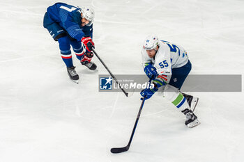 24/04/2024 - Robert SABOLIC of Slovenia and Sacha TREILLE of France during the International Friendly Ice Hockey match between France and Slovenia on April 24, 2024 at Aren’Ice in Cergy-Pontoise, France - ICE HOCKEY - FRIENDLY GAME - FRANCE V SLOVENIA - HOCKEY SU GHIACCIO - SPORT INVERNALI
