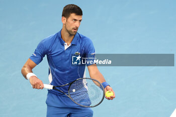 2024-01-14 - Novak Djokovic (SRB) In action during their round one singles match against Dino Primiz (CRO) on day one of the 2024 Australian Open at Melbourne Park on January 14, 2024 in Melbourne, Australia. - AUSTRALIAN OPEN - INTERNATIONALS - TENNIS