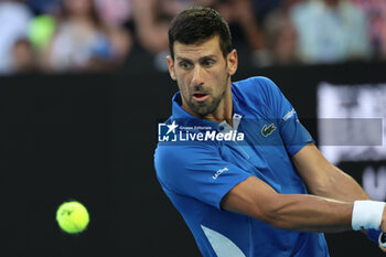 2024-01-14 - Novak Djokovic (SRB) In action during their round one singles match against Dino Primiz (CRO) on day one of the 2024 Australian Open at Melbourne Park on January 14, 2024 in Melbourne, Australia. - AUSTRALIAN OPEN - INTERNATIONALS - TENNIS