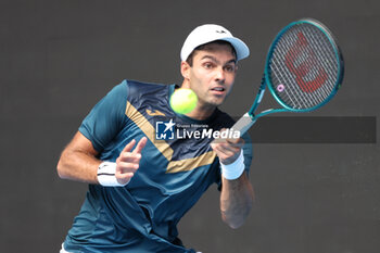 2024-01-14 - Facundo Diaz Acosta (BRA) In action during their round one singles match against Taylor Fritz (USA) on day one of the 2024 Australian Open at Melbourne Park on January 14, 2024 in Melbourne, Australia. - AUSTRALIAN OPEN - INTERNATIONALS - TENNIS