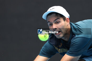 2024-01-14 - Facundo Diaz Acosta (BRA) In action during their round one singles match against Taylor Fritz (USA) on day one of the 2024 Australian Open at Melbourne Park on January 14, 2024 in Melbourne, Australia. - AUSTRALIAN OPEN - INTERNATIONALS - TENNIS