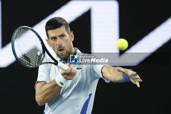 2024-01-21 - Novak Djokovic (SRB) in action during their round four singles match against Adrian Mannarino (FRA) - AUSTRALIAN OPEN - INTERNATIONALS - TENNIS