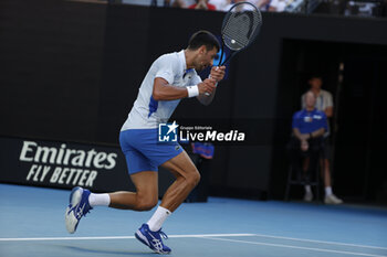 2024-01-23 - Novak Djokovic (SRB) in action during their quarterfinals match against Tayor Fritz (USA) - AUSTRALIAN OPEN - INTERNATIONALS - TENNIS