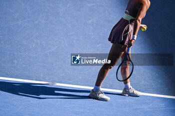 2024-01-20 - Illustration picture shows the body and shadow of a female woman player during a serve during the Australian Open AO 2024 Grand Slam tennis tournament on January 20, 2024 at Melbourne Park in Australia. Photo Victor Joly / DPPI - TENNIS - AUSTRALIAN OPEN 2024 - WEEK 1 - INTERNATIONALS - TENNIS
