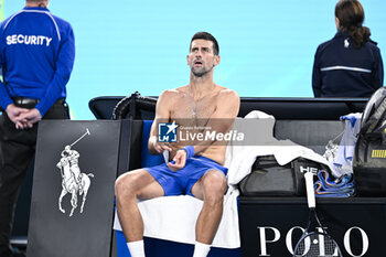2024-01-19 - Novak Djokovic of Serbia bare-chested shirtless or naked torso during the Australian Open AO 2024 Grand Slam tennis tournament on January 19, 2024 at Melbourne Park in Australia. Photo Victor Joly / DPPI - TENNIS - AUSTRALIAN OPEN 2024 - WEEK 1 - INTERNATIONALS - TENNIS