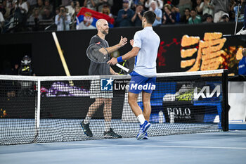 2024-01-21 - Novak Djokovic and Adrian Mannarino during the Australian Open AO 2024 Grand Slam tennis tournament on January 21, 2024 at Melbourne Park in Australia. Photo Victor Joly / DPPI - TENNIS - AUSTRALIAN OPEN 2024 - WEEK 1 - INTERNATIONALS - TENNIS