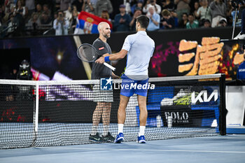 2024-01-21 - Novak Djokovic and Adrian Mannarino during the Australian Open AO 2024 Grand Slam tennis tournament on January 21, 2024 at Melbourne Park in Australia. Photo Victor Joly / DPPI - TENNIS - AUSTRALIAN OPEN 2024 - WEEK 1 - INTERNATIONALS - TENNIS
