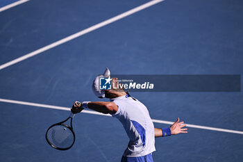2024-01-23 - Novak Djokovic of Serbia serves during the Australian Open 2024 Grand Slam tennis tournament on January 22, 2024 at Melbourne Park in Melbourne, Australia. Photo Victor Joly / DPPI - TENNIS - AUSTRALIAN OPEN 2024 - WEEK 2 - INTERNATIONALS - TENNIS