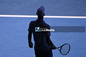 2024-01-23 - Novak Djokovic in the dark shadows (illustration of shadow silhouette or shade) during the Australian Open 2024 Grand Slam tennis tournament on January 22, 2024 at Melbourne Park in Melbourne, Australia. Photo Victor Joly / DPPI - TENNIS - AUSTRALIAN OPEN 2024 - WEEK 2 - INTERNATIONALS - TENNIS