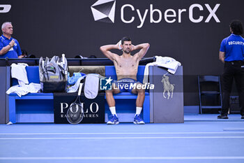 2024-01-23 - Novak Djokovic of Serbia bare-chested shirtless or naked torso during the Australian Open 2024 Grand Slam tennis tournament on January 22, 2024 at Melbourne Park in Melbourne, Australia. Photo Victor Joly / DPPI - TENNIS - AUSTRALIAN OPEN 2024 - WEEK 2 - INTERNATIONALS - TENNIS