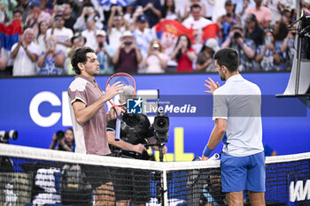 2024-01-23 - Novak Djokovic and Taylor Fritz during the Australian Open 2024 Grand Slam tennis tournament on January 22, 2024 at Melbourne Park in Melbourne, Australia. Photo Victor Joly / DPPI - TENNIS - AUSTRALIAN OPEN 2024 - WEEK 2 - INTERNATIONALS - TENNIS